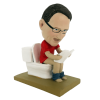 Custom made bobbleheads reading in the toilet